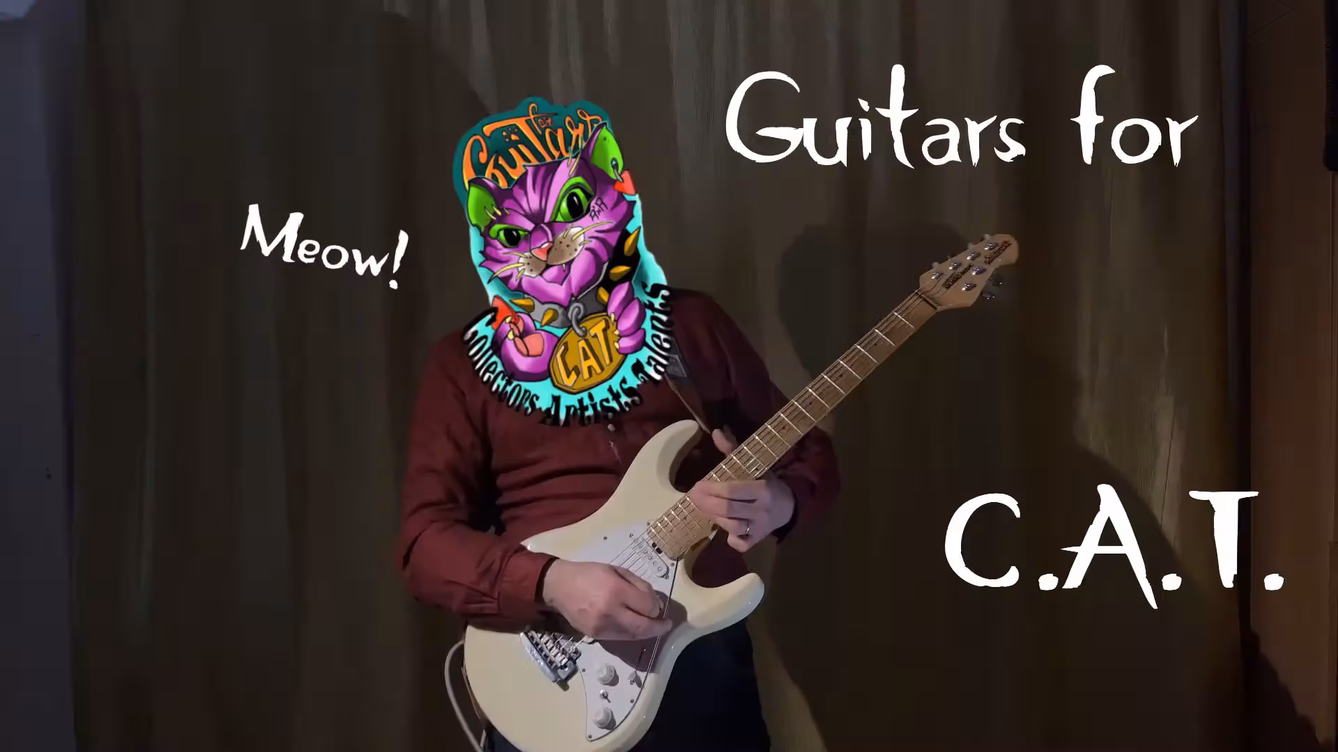 Hajas Tamás (Leisure Guitar) gitárral és a Guitars for C.A.T. macskás logójával.